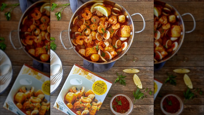 Box of Trader Joe's Seafood Boil next to a pot of the same dish