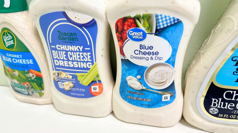 Extreme close up of several bottles of blue cheese dressings