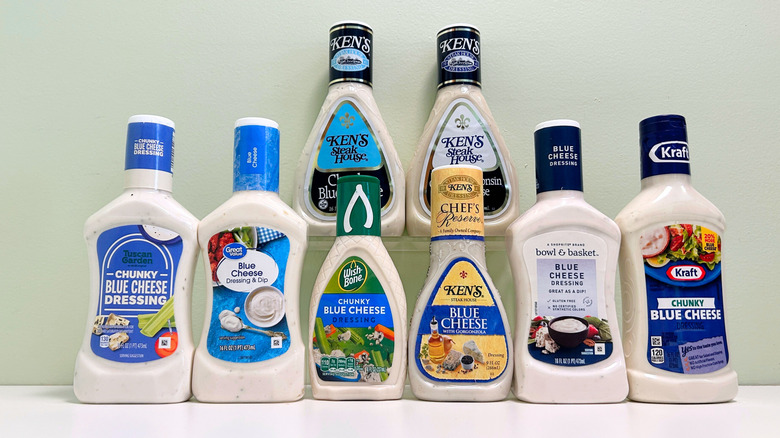 Eight bottles of blue cheese dressings arranged in two rows
