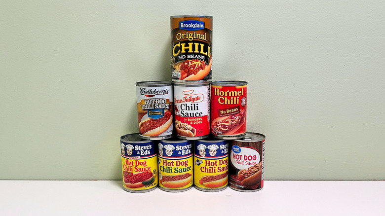 Eight cans of hot dog chili stacked in a pyramid