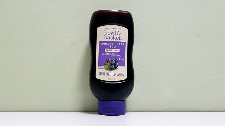A container of Bowl and Basket Concord Grape Jelly Squeezable