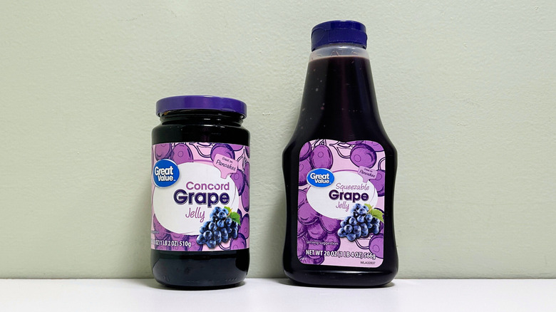 A jar of Great Value Concord Grape Jelly next to a container of Great Value Squeezable Grape Jelly