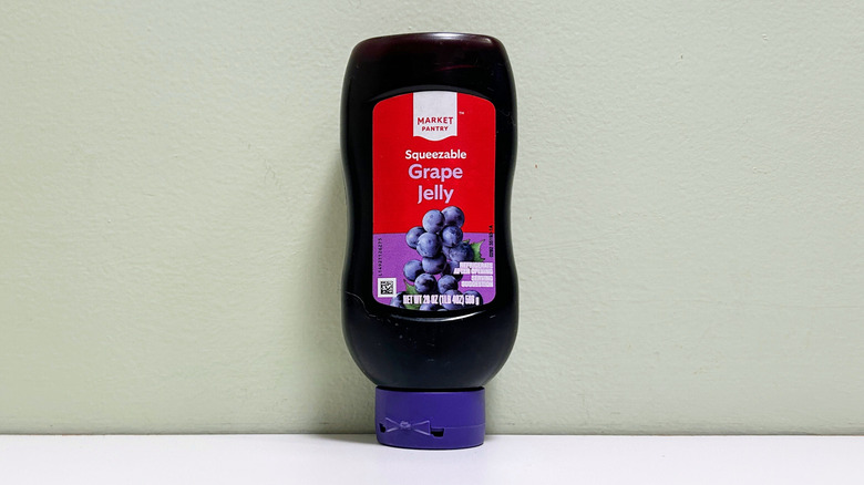 A container of Market Pantry Squeezable Grape Jelly