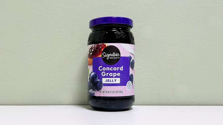 A jar of Signature Select Concord Grape Jelly