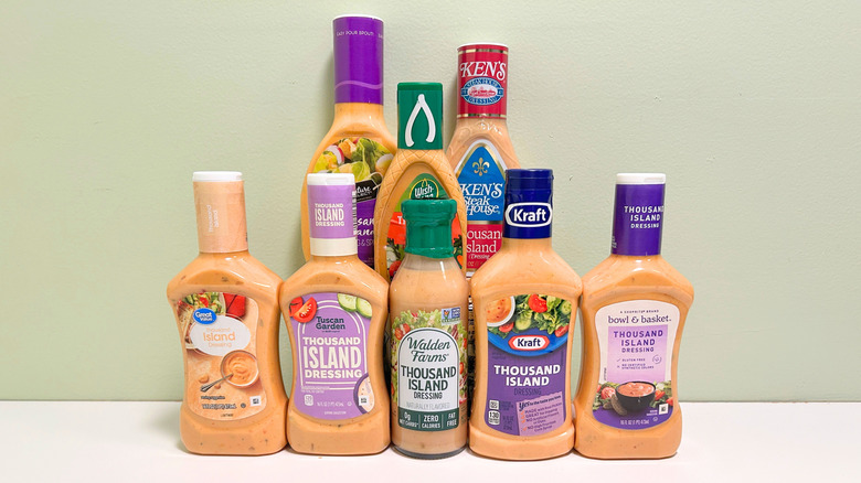 Several bottles of thousand island dressing from different brands arranged together