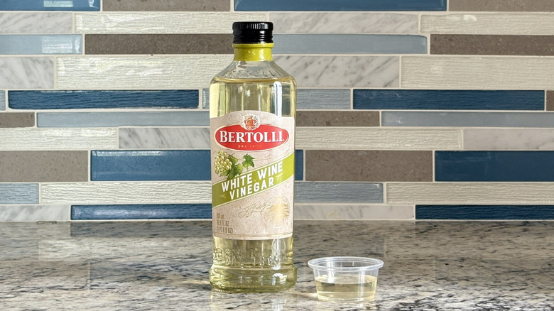 A bottle of Bertolli white wine vinegar