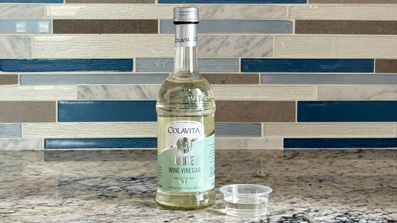 A bottle of Colavita white wine vinegar