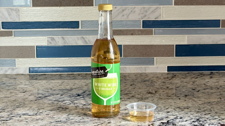 A bottle of Signature Select white wine vinegar
