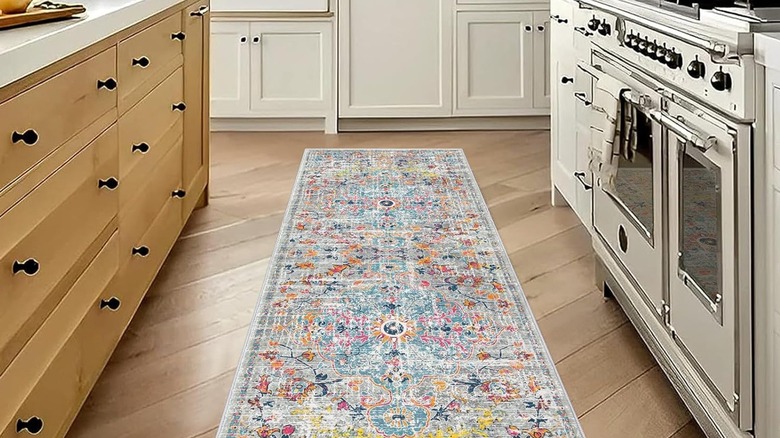 Gray and multi-colored runner on kitchen floor