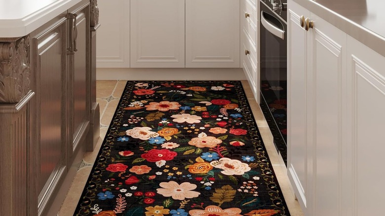 Black and floral runner rug in kitchen