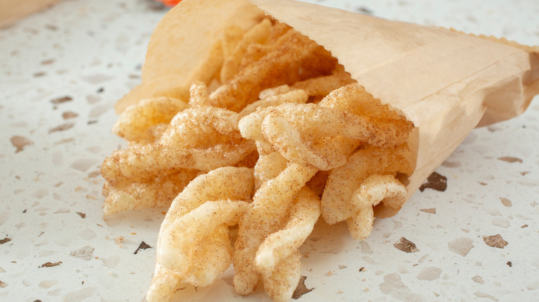 Taco Bell Cinnamon Twists in a paper bag placed on a marble table