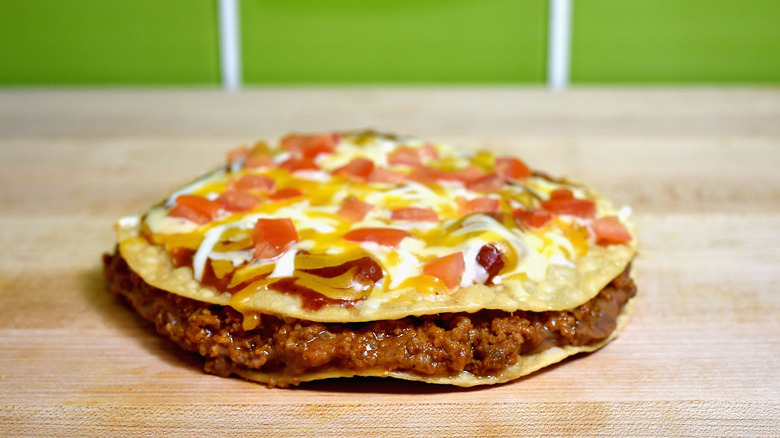Taco Bell Mexican Pizza on a wooden table