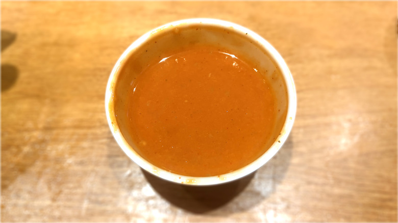 plastic container of mild wing sauce