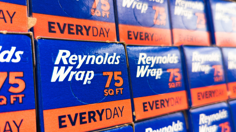 A shelf full of Reynolds Wrap stacked upon eachother