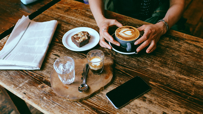 coffee and pastry at cafe table