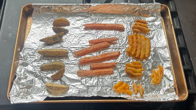 Various potato sides on a baking tray