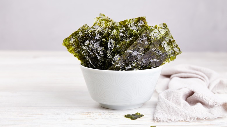 Seaweed in white bowl with towel