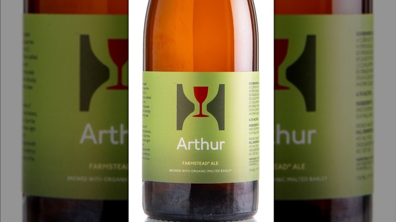 bottle of arthur farmstead ale on white background