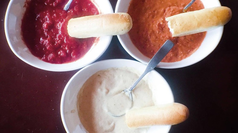 Overhead view of Olive Garden breadstiks paires with sauces