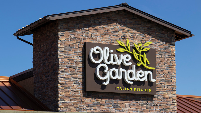 Exterior sign on an Olive Garden restaurant
