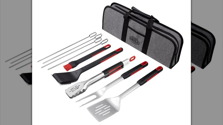 Set of grilling accessories with case against a white background