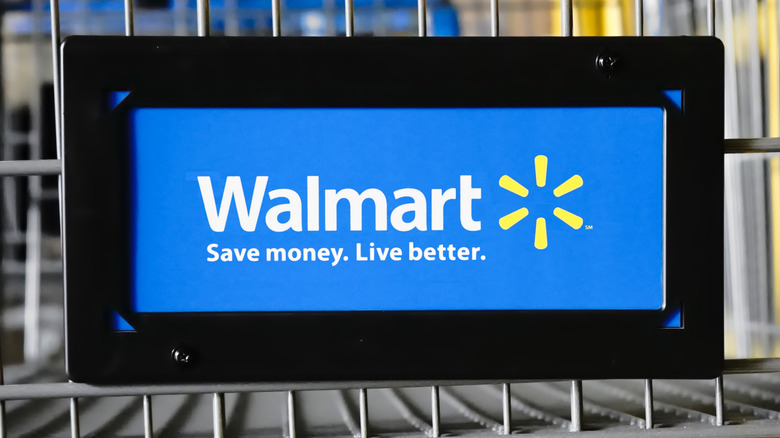 A close up of a Walmart logo on a shopping cart