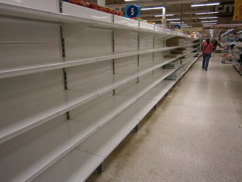 The nation's meager food supply is under armed guard but shelves are still empty.