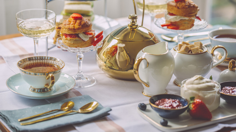 A table of tea and desserts