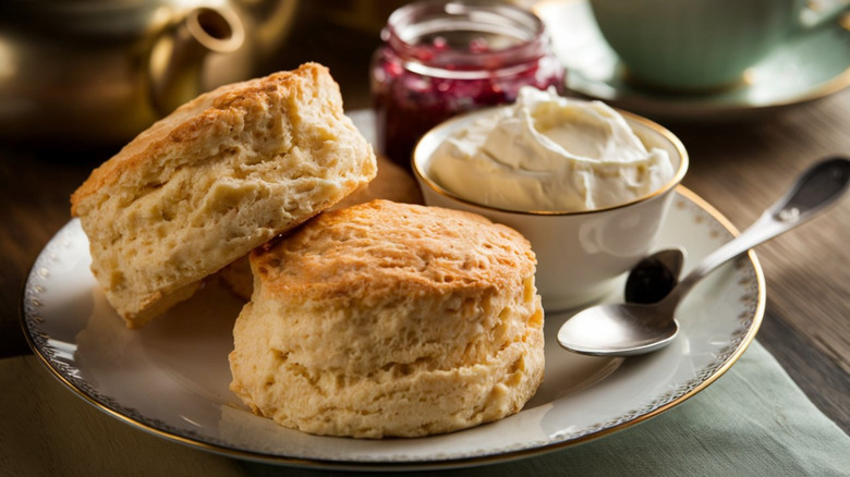 Plate of two scones with cream and jam