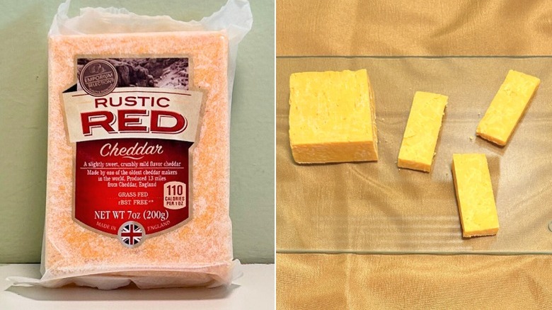 A block of Emporium Selection Rustic Red Cheddar Cheese next to cheddar cheese on a glass cutting board