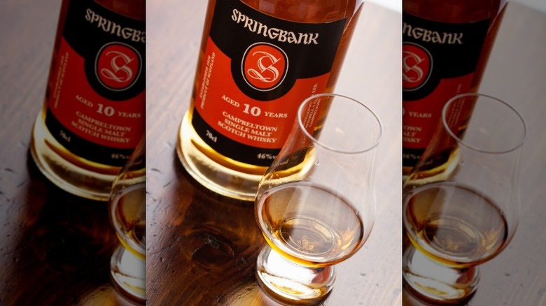 A bottle of Springbank 10 Year Old Scotch whisky next to a dram