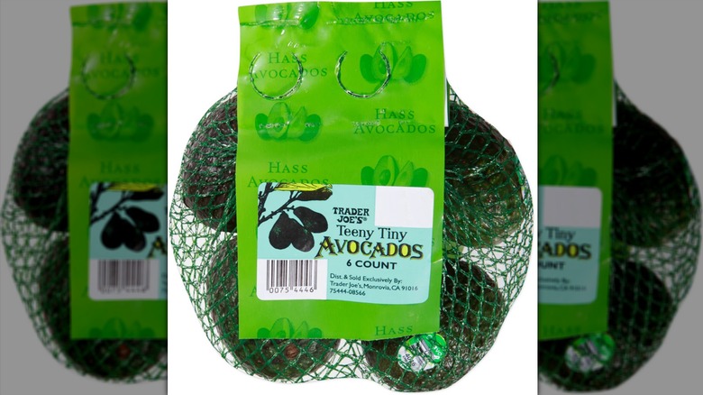 A mesh bag of six small Trader Joe's avocados
