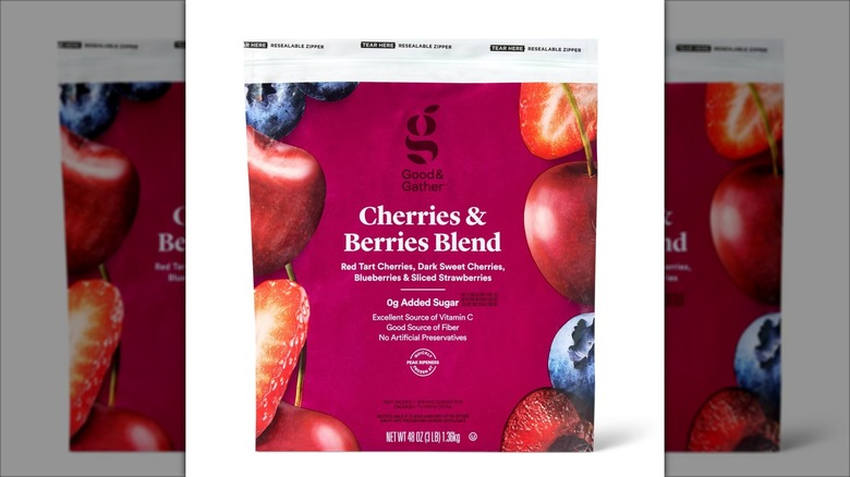A closeup photo of the package for Good & Gather Cherries and Berries Frozen Blend against a mirrored background