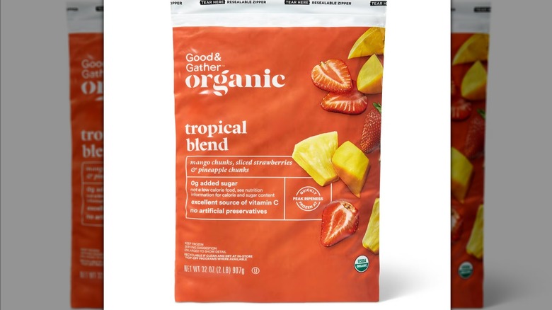 A photo of the product package for the Target Good & Gather brand Frozen Tropical Fruit against a mirrored backdrop