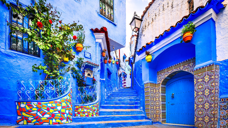 An alleyway in a Moroccan town, painted bright blue and white