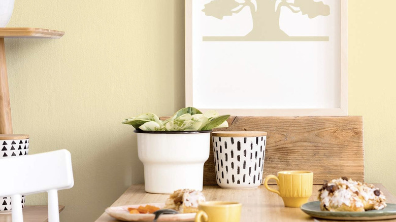 A kitchen table against a light yellow wall