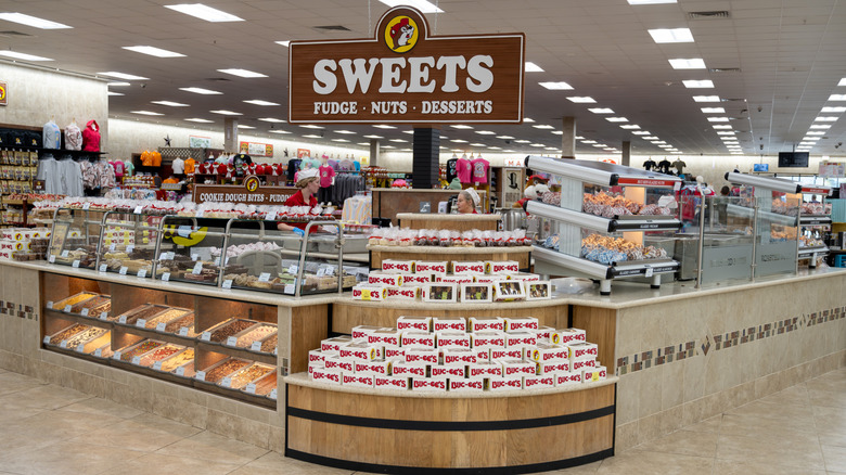 Buc-ee's sweets section with a sign that says "sweets: fudge, nuts, desserts"