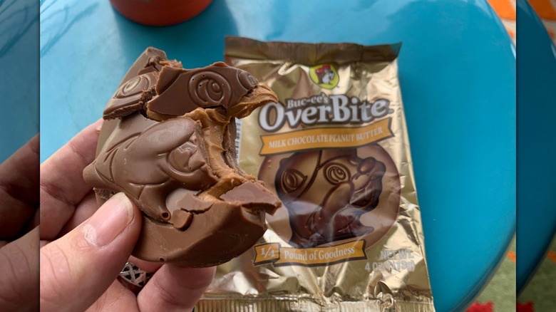 A hand holding Buc-ee's milk chocolate peanut butter OverBite
