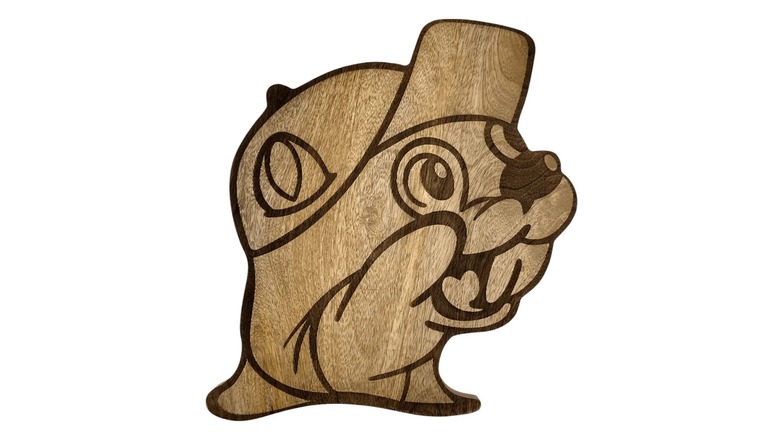 A wooden cutting board in the shape of the Buc-ee's logo against a white background