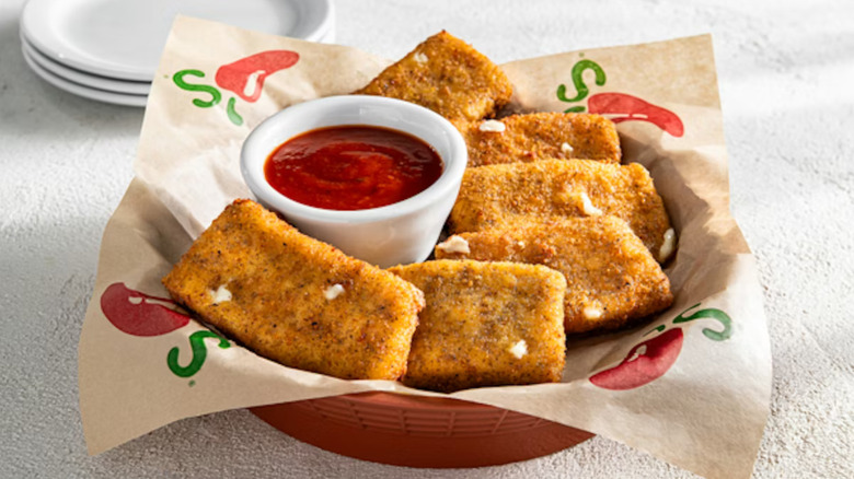 A basket of Fried Mozzarella from Chili's with marinara dipping sauce