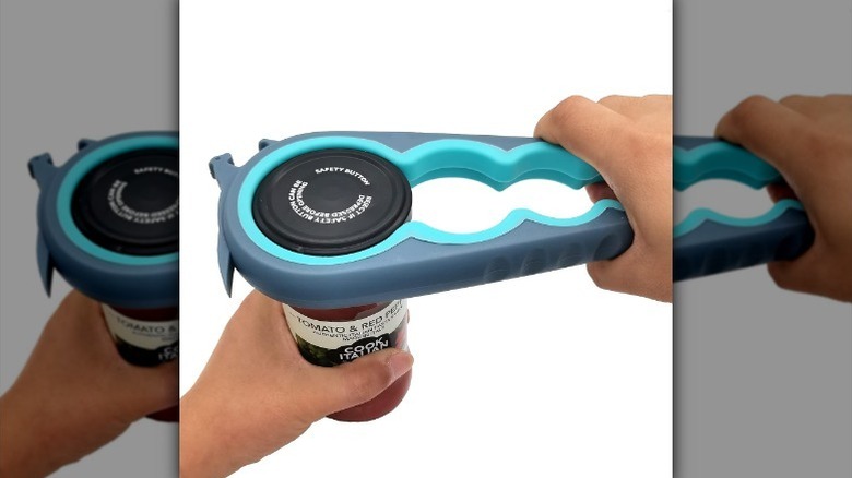 Hand using jar opener