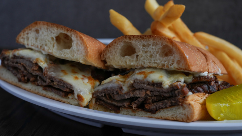 A tri-tip sandwich, served with fries