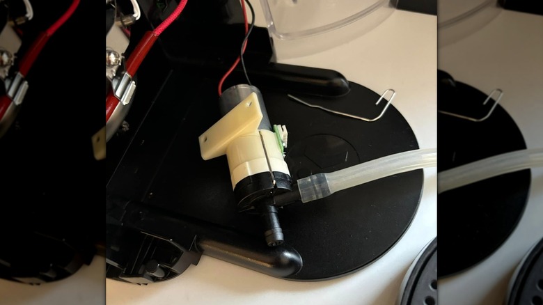 Close-up of internal plastic piece from a Keurig