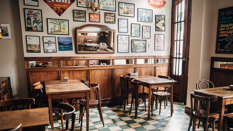 Vintage artwork hanging on the wall in a casual restaurant's dining room