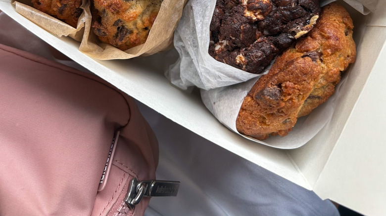 A closeup of four large cookies from Levain Bakery