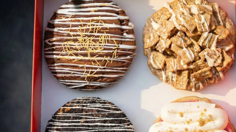 A closeup photo of four Crave cookies in a box