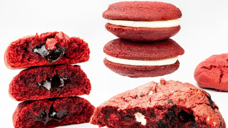 A pile of red velvet cookies against a white background.