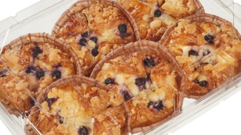 six Costco blueberry cheesecake caramelized croissants in plastic tray