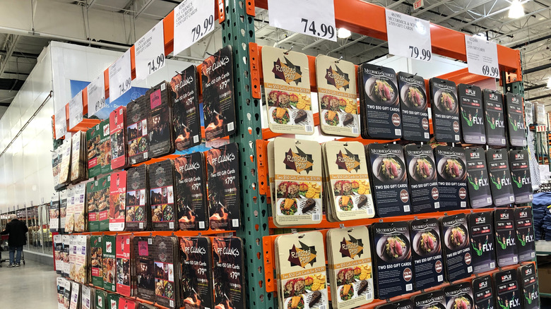 Costco gift cards arranged on a rack.