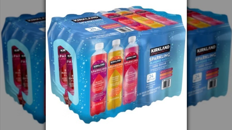 Sparkling flavored water on white background